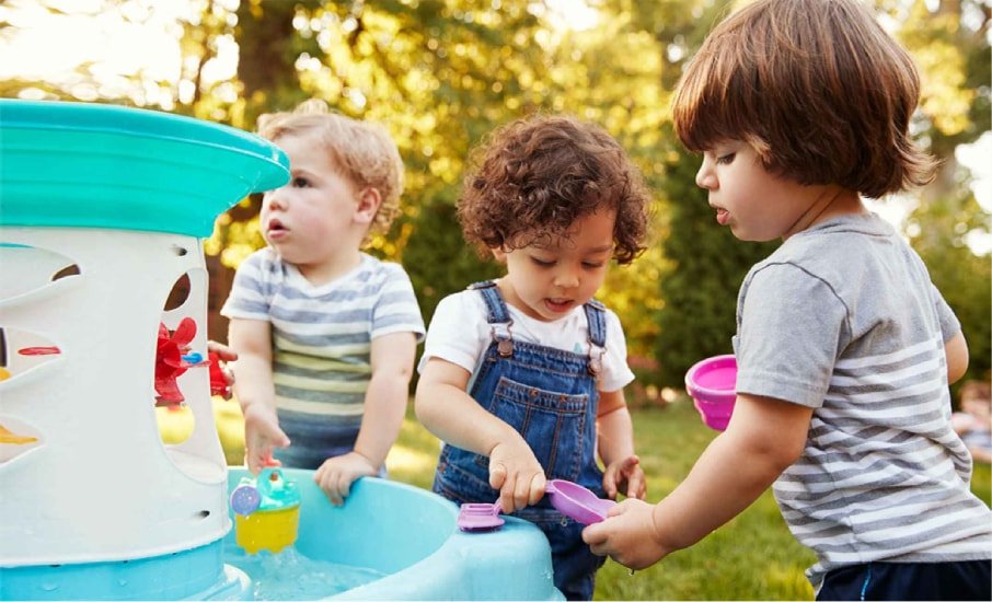Children playing at a water table in a Calgary daycare
