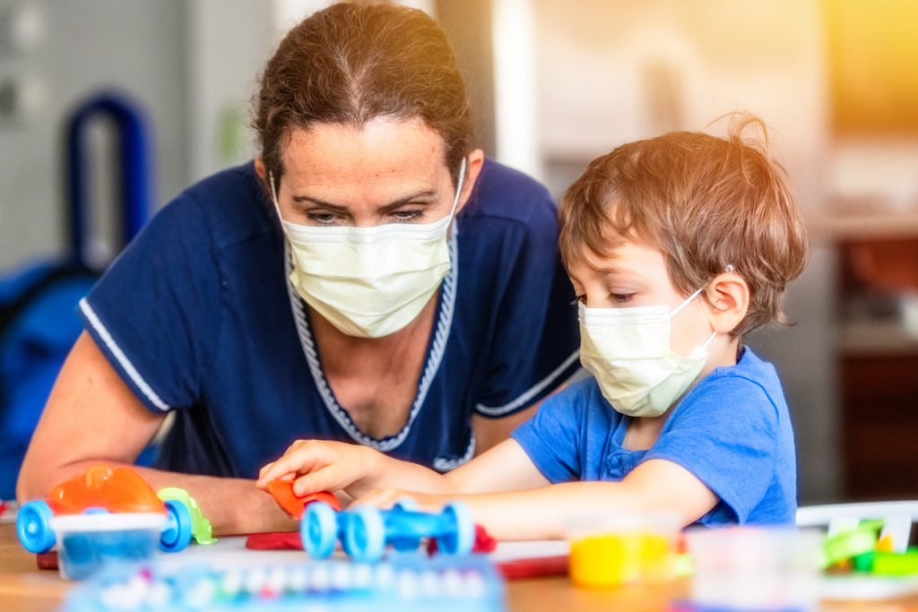 Child boy learning with colorful clays while locked down because pandemic