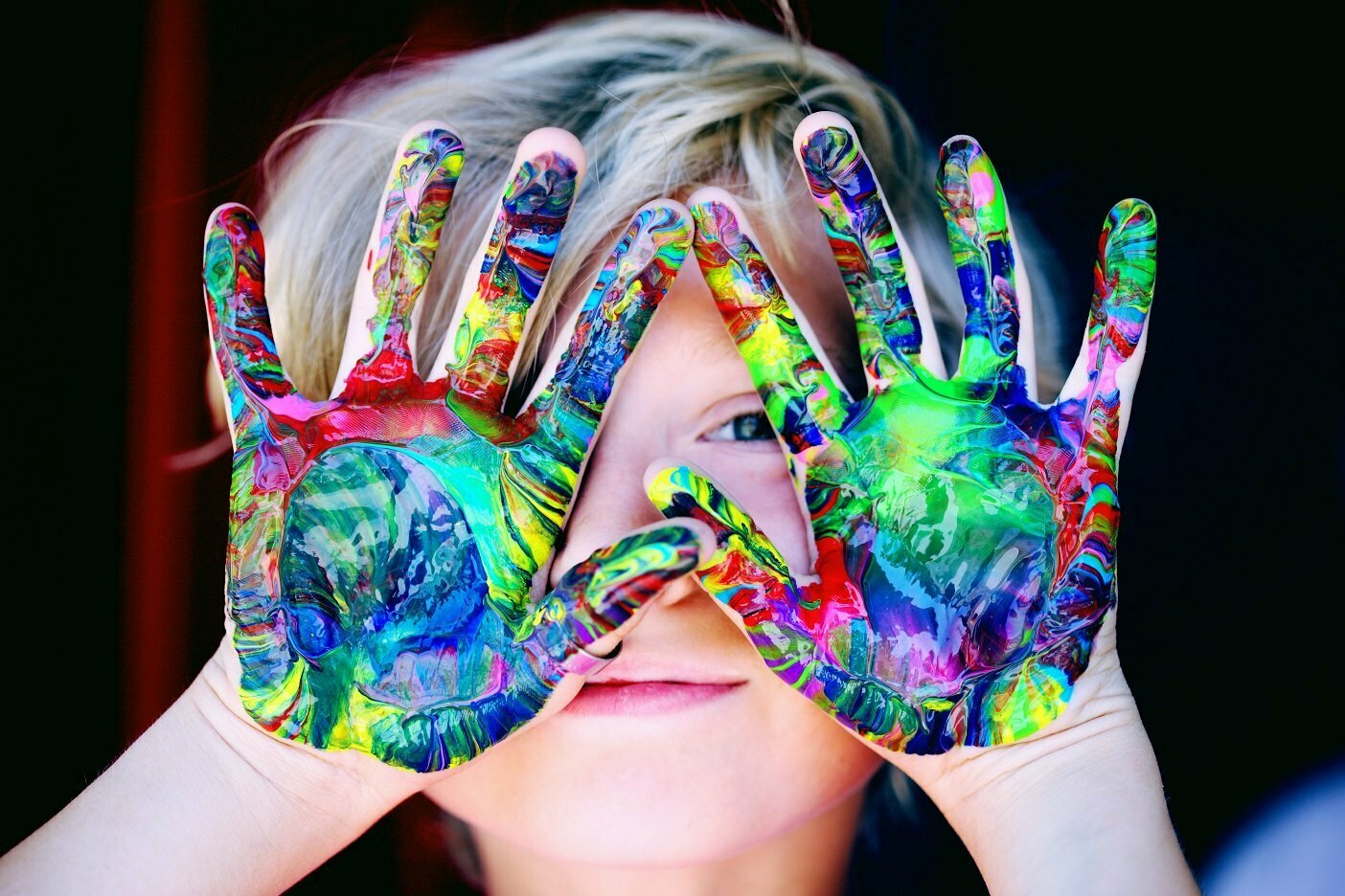 child care child with paint on hands