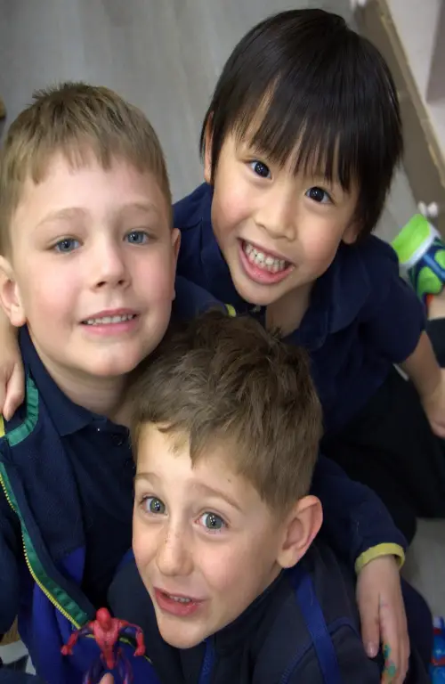 3 children playing with blocks at a Calgary daycare